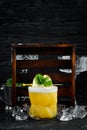 Yellow tropical drink cocktail in a glass. Royalty Free Stock Photo