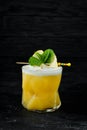 Yellow tropical drink cocktail in a glass. Royalty Free Stock Photo