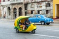 HAVANA, CUBA - OCTOBER 21, 2017: Yellow Tuk Tuk Taxi in Havana, Cuba. Royalty Free Stock Photo