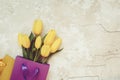 Yellow tulips in gift paper bag