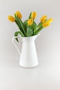 Yellow tullips in jug Royalty Free Stock Photo