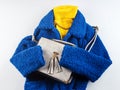 Yellow turtle neck with gray handbag, blue coat Royalty Free Stock Photo