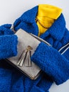 Yellow turtle neck with gray handbag, blue coat Royalty Free Stock Photo