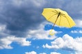Yellow umbrella against sky