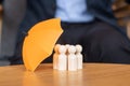 Yellow umbrella cover man wooden from crowd of employees. People, Business, Human resource management, Life Insurance and Teamwork