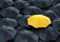 Yellow umbrella among dark ones