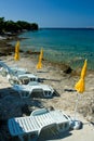 Yellow umbrellas on beach, Adriatic sea Royalty Free Stock Photo