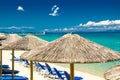 Yellow umbrellas on beach, blue paradise water, Halkidiki, Greece Royalty Free Stock Photo