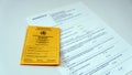 Yellow vaccination certificate with anamnesis sheet Royalty Free Stock Photo