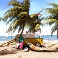 Yellow van with summer accessories on beautiful tropical sand beach. Summer travel concept background. Royalty Free Stock Photo