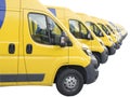 Yellow vans lined up and parked in a long row isolated on white background. Delivery trucks fleet Royalty Free Stock Photo