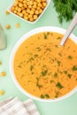 Yellow vegan puree soup with vegetables and pea for healthy menu