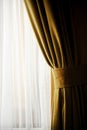 Yellow velvet window curtain Royalty Free Stock Photo