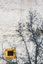 Yellow Ventilation Window and Shadow of Tree at Chateau de Neuchatel - Neuchatel, Switzerland Royalty Free Stock Photo