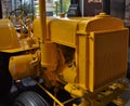 Yellow very old antique tractor