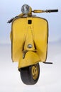 Yellow Vespa scooter front Royalty Free Stock Photo