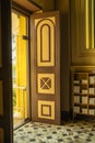 Yellow vintage door That has magnificent carvings being opened