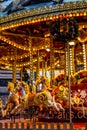 Yellow Vintage merry-go-round wooden horses in carusel