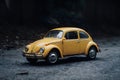 Yellow vintage retro toy car isolated, transportation symbol concept