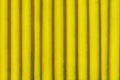 Yellow vintage rugged metal corrugated iron fence. Background for your design Royalty Free Stock Photo