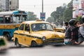 Yellow vintage taxi on the road in Kolkata, India. Royalty Free Stock Photo