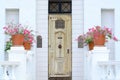 Yellow vintage wooden door on white wall Royalty Free Stock Photo