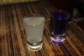 Yellow and violet shots of vodka