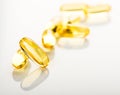 Yellow vitamin e fish oil capsule Royalty Free Stock Photo
