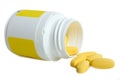 Yellow vitamins and bottle Royalty Free Stock Photo