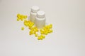 Yellow vitamins on a white background