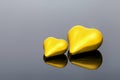 Yellow volumetric couple hearts the symbol of love.