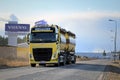 Yellow Volvo FH Tank Truck on the Road with Volvo Trucks Sign