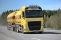 Yellow Volvo FH Tank Truck on Spring Road