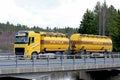 Yellow Volvo Tank Truck on Bridge