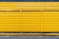 A yellow wall with a blue door and a yellow door. AI Royalty Free Stock Photo