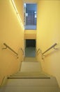 Yellow walls building interior with stairs and handrails. Nobody Royalty Free Stock Photo