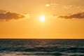 Yellow warm sun over deep blue sea at scenic sunset sky, endless sea in warm bright sunlight Royalty Free Stock Photo