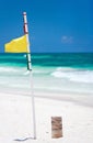 Yellow warning flag at beach Royalty Free Stock Photo