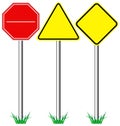 Yellow warning information and red stop road signs with grass is Royalty Free Stock Photo