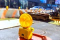 Yellow warning orange construction light mounted on a barricade intended to warn at construction site Royalty Free Stock Photo