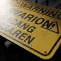 Yellow warning sign with black text, Royalty Free Stock Photo