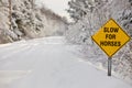 A Yellow Warning Sign reading Slow for Horses Royalty Free Stock Photo