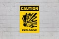 Caution, Explosive sign on a cinder block wall Royalty Free Stock Photo