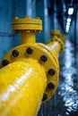 A yellow water pipe with black dots on it in a tunnel, AI Royalty Free Stock Photo