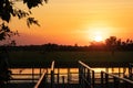 Yellow water pond at sunset time Ngurrungurrudjba. Platform on the pond. Habitat for birds and crocodiles. Boat tours organized Royalty Free Stock Photo