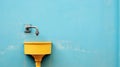 A yellow water spout on a blue wall with an orange handle, AI Royalty Free Stock Photo