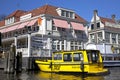 Yellow water taxi in Amsterdam, Netherlands