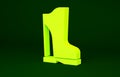 Yellow Waterproof rubber boot icon isolated on green background. Gumboots for rainy weather, fishing, gardening