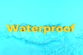 yellow waterproof sign on a blue background