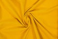 Yellow wavy fabric in a spiral shape